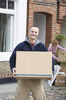 Movers helping with a home move in Brixton street