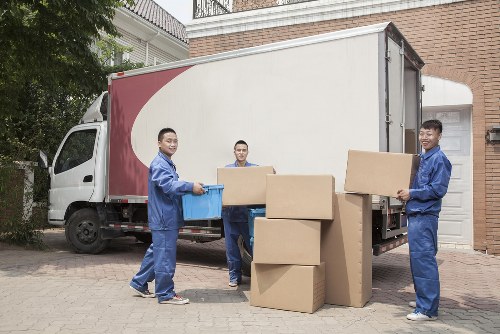 Relocation team handling office items in a Brixton workspace