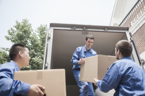 Packed boxes and furniture ready for loading into a Brixton moving truck