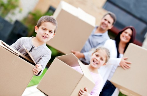 Removal van and moving team in a Brixton residential street
