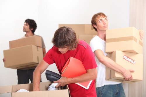 Staff using PPE during a professional moving job in Brixton