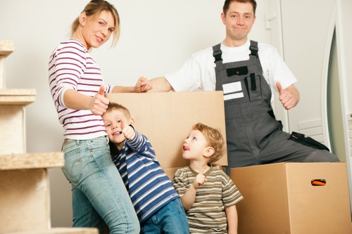 Moving team handling boxes near Brixton flats